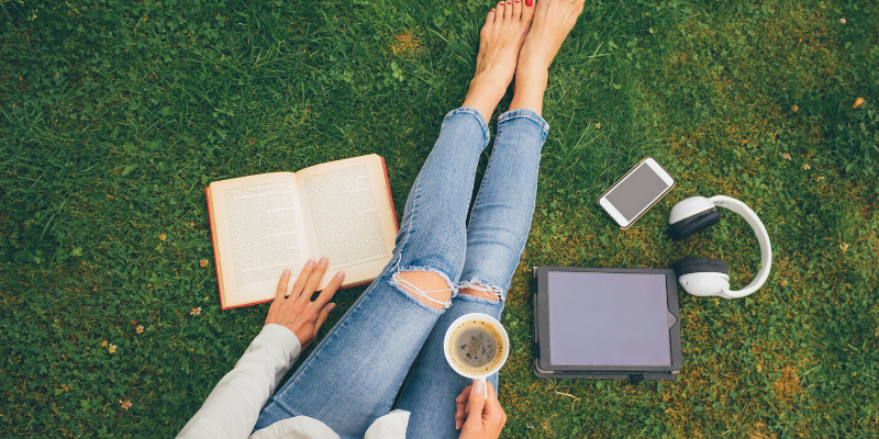 outside, grass, reading, tea, tablet, pets, pet health, separation anxiety, returning to work, Animal Emergency & Referral Center of Minnesota, pet safety, Twin Cities animal hospital, Twin Cities veterinary clinic, Minnesota animal hospital