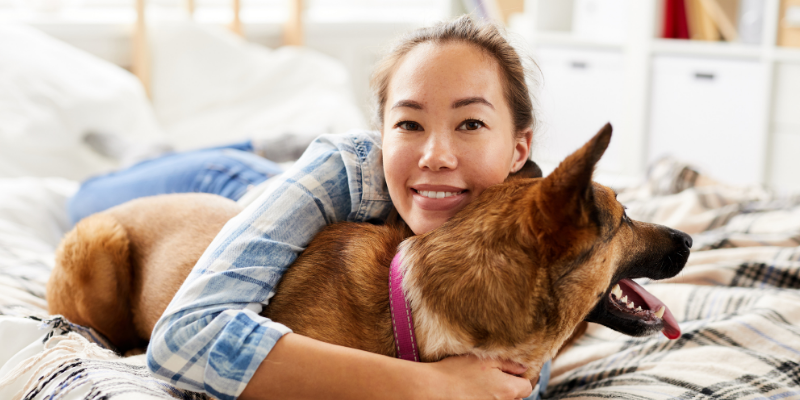 woman hugging dog, Zoonotic Diseases, zoonotic diseases in cats and dogs, understanding zoonotic diseases, preventing zoonotic diseases, pet owners, pet health, Animal Emergency & Referral Center of Minnesota, emergency vet, Twin Cities emergency vet, Saint Paul animal emergency hospital, Twin Cities animal emergency hospital, Oakdale animal emergency hospital, east metro animal emergency hospital