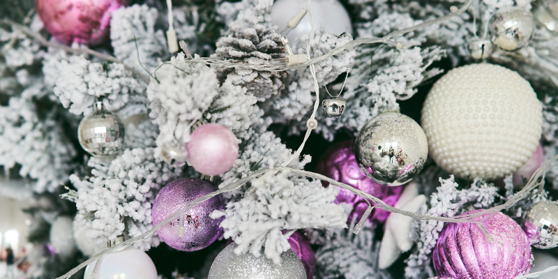 Christmas tree with flocking, purple and pink glass ornaments, holiday pet toxins, Animal Emergency & Referral Center of Minnesota