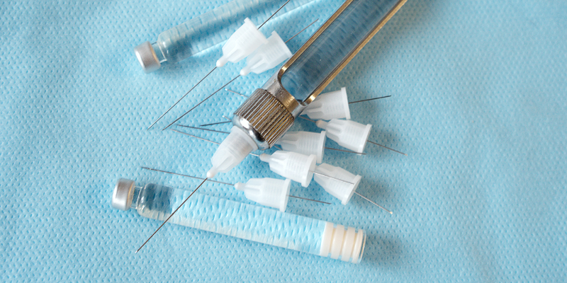 A blue background with needles.