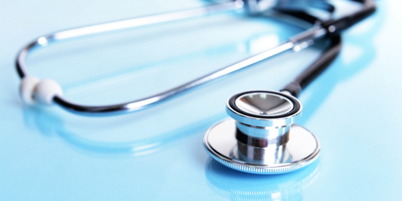 A stethoscope on a blue background.