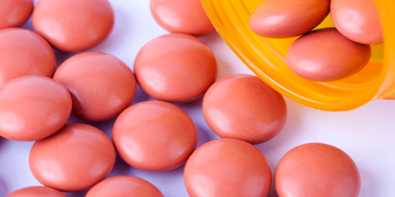 A bottle of ibuprofen spilled out.