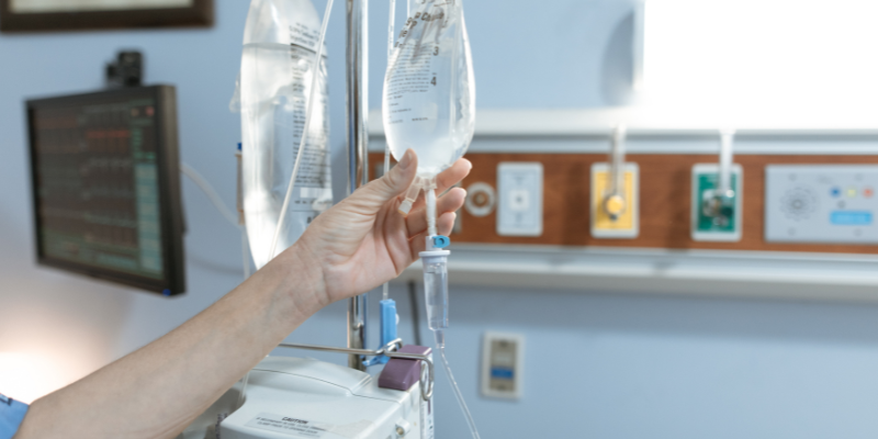bags of fluids hanging from an IV pole